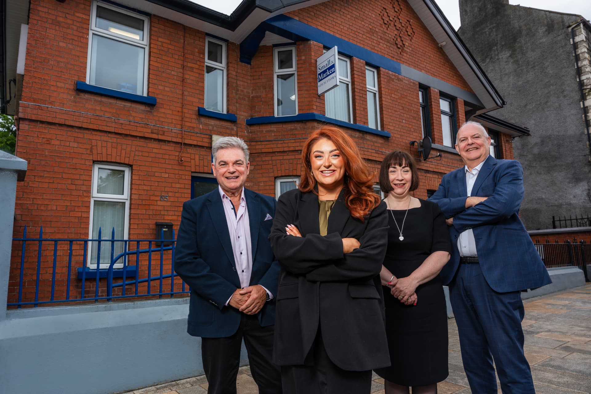 The Small & Marken Solicitors team outside their office at 65 Church Street, Antrim